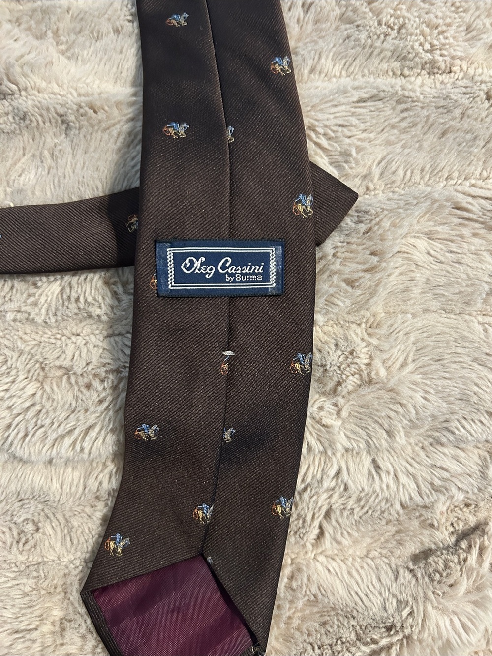 Vintage-Oleg Cassini Brown Tie with Small Blue and Gold Motifs vintage